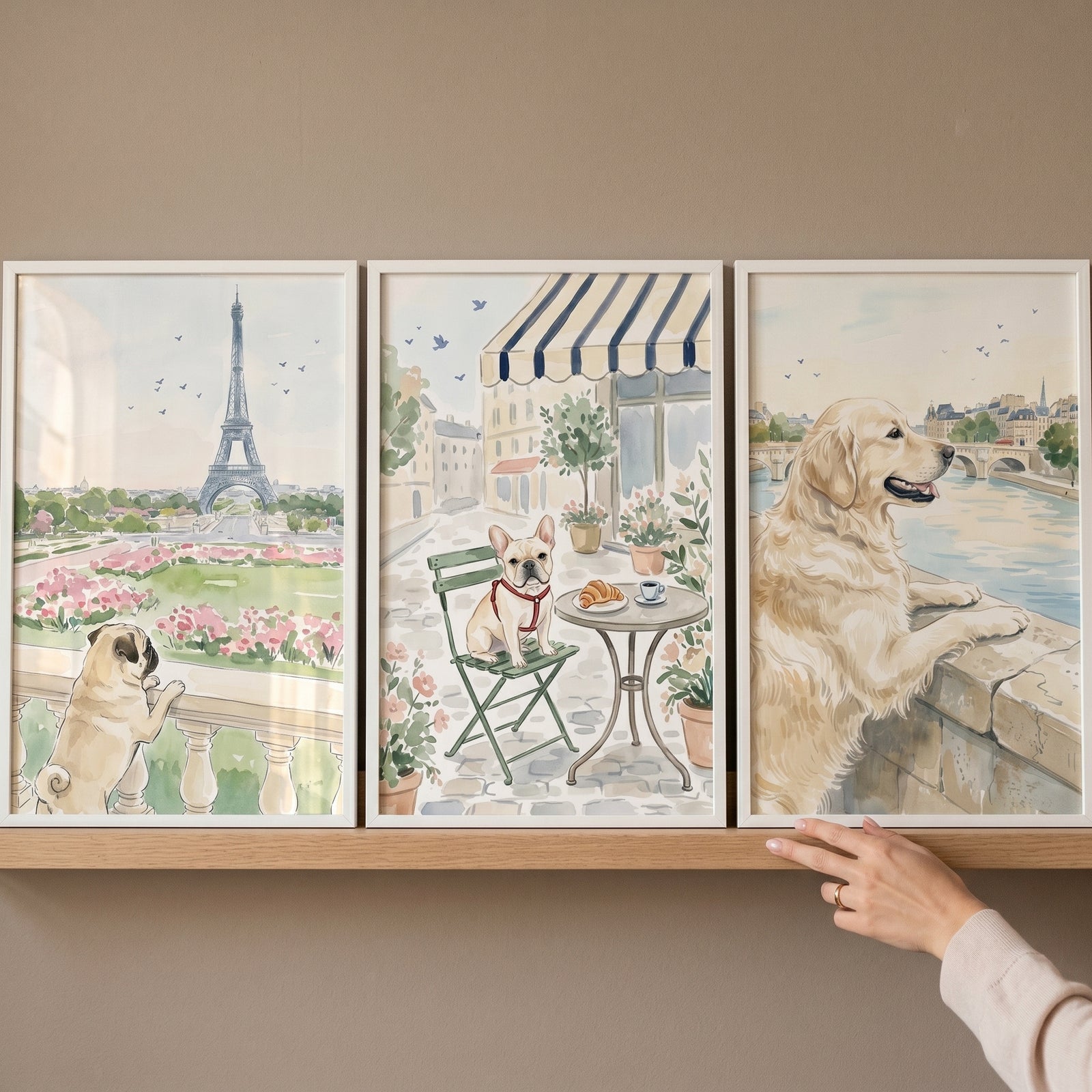 Pastel parisian dog wall art set of 3 watercolor style prints of a pug, French bulldog, and retriever in city settings.