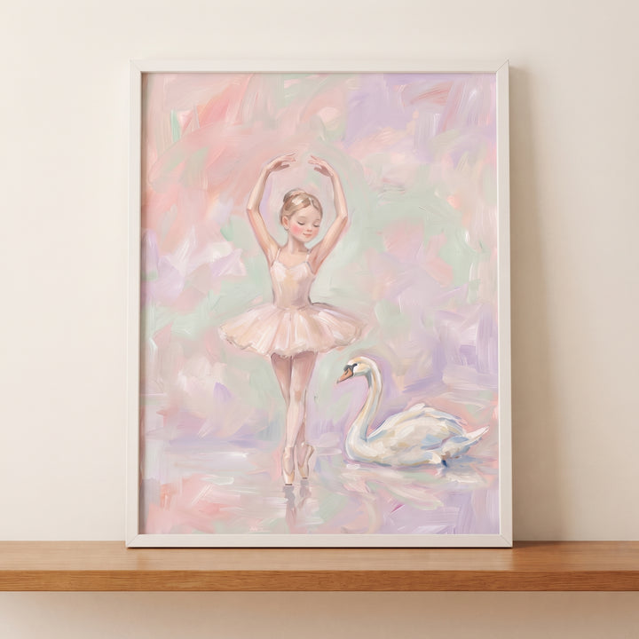 Pastel pink ballerina wall art featuring a dancer and swan in soft colors, framed on a wooden shelf.