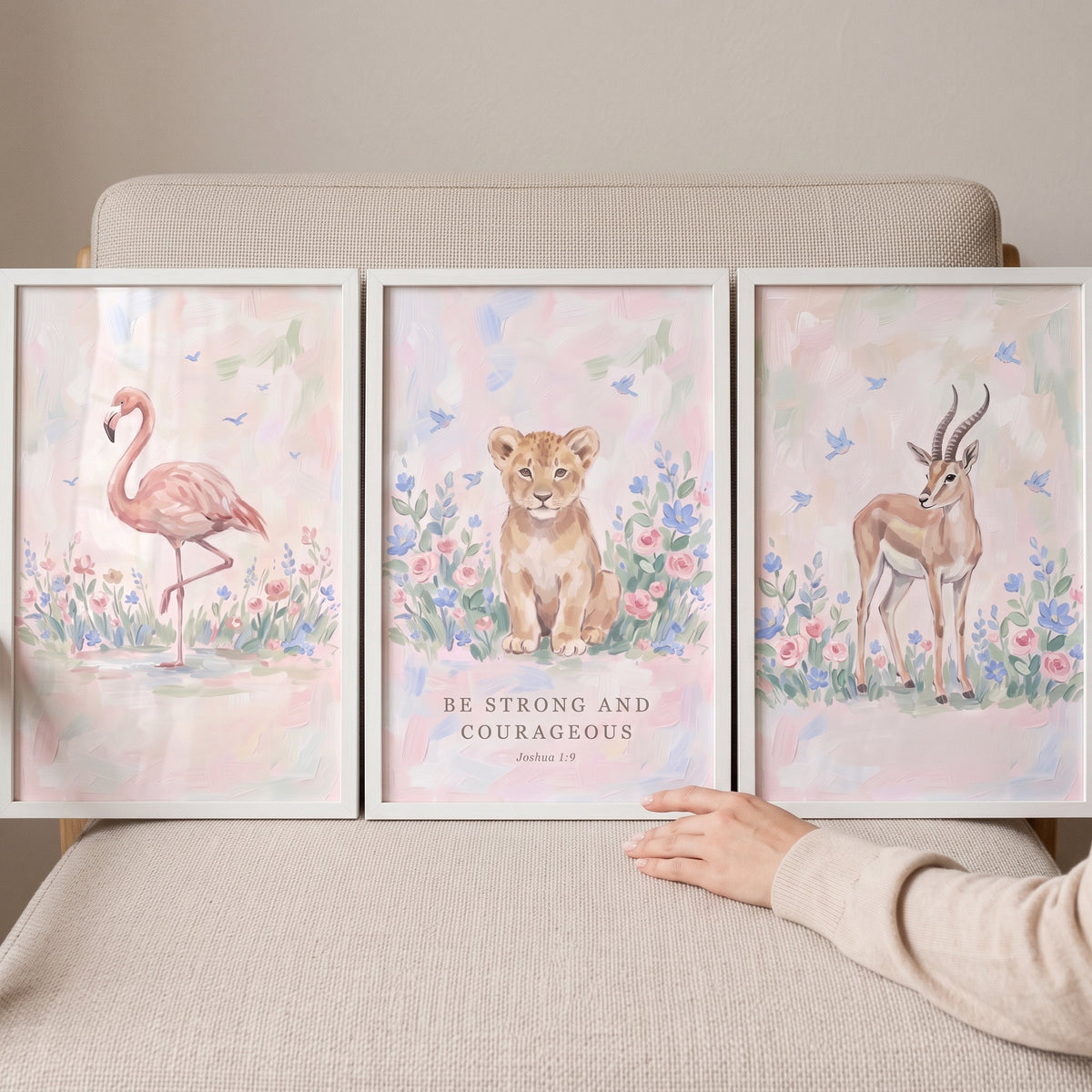 Pastel prairie safari animals wall art set of 3 features watercolor flamingo, lion cub, and gazelle with Joshua 1:9 text.