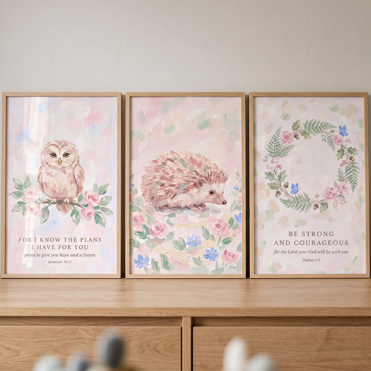 Framed owl, hedgehog, and wreath with scripture verses in this pastel rose forest nature wall art set of 3.