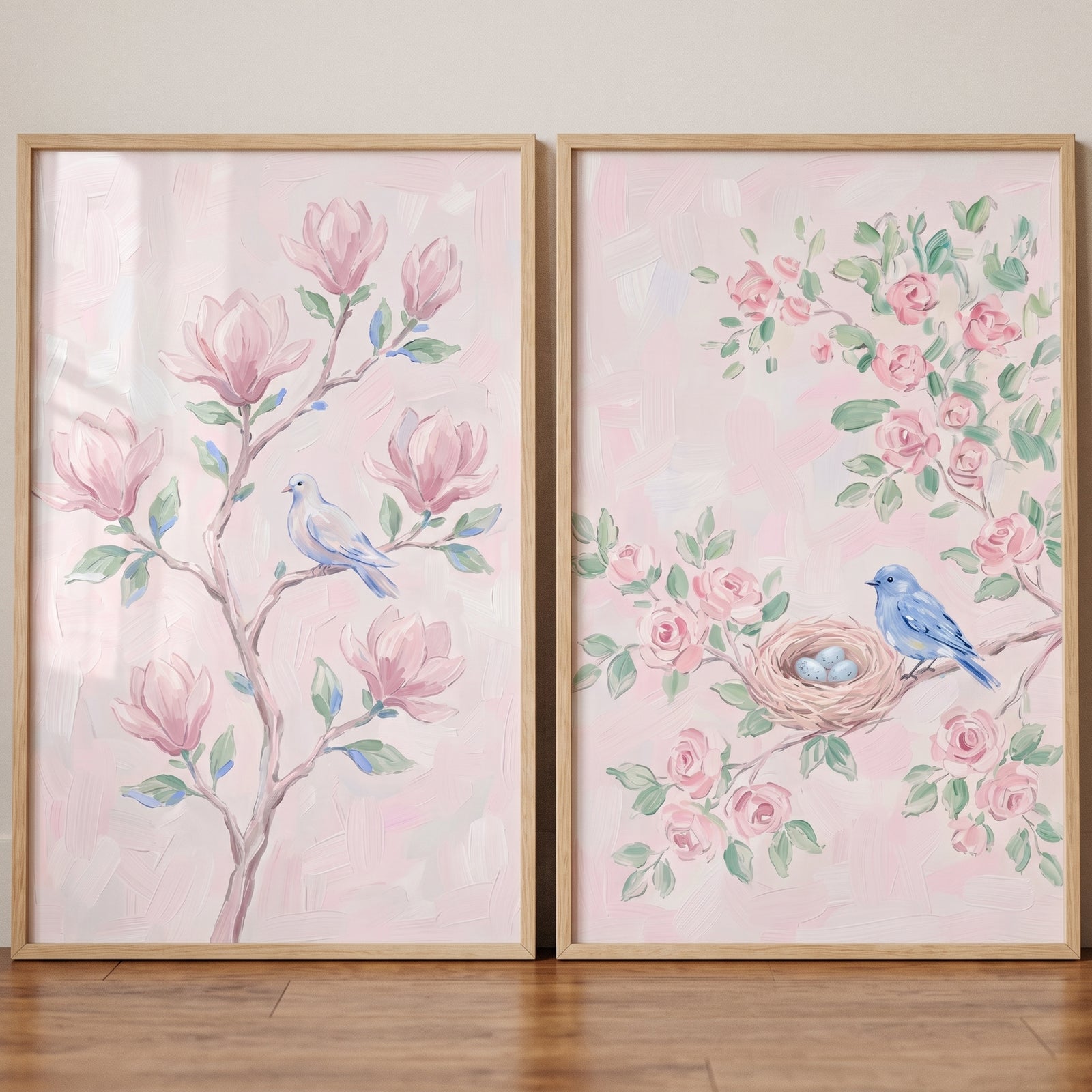 Pastel watercolor floral bird wall art set of 2 with blue birds, pink flowers, and a nest in light wood frames.