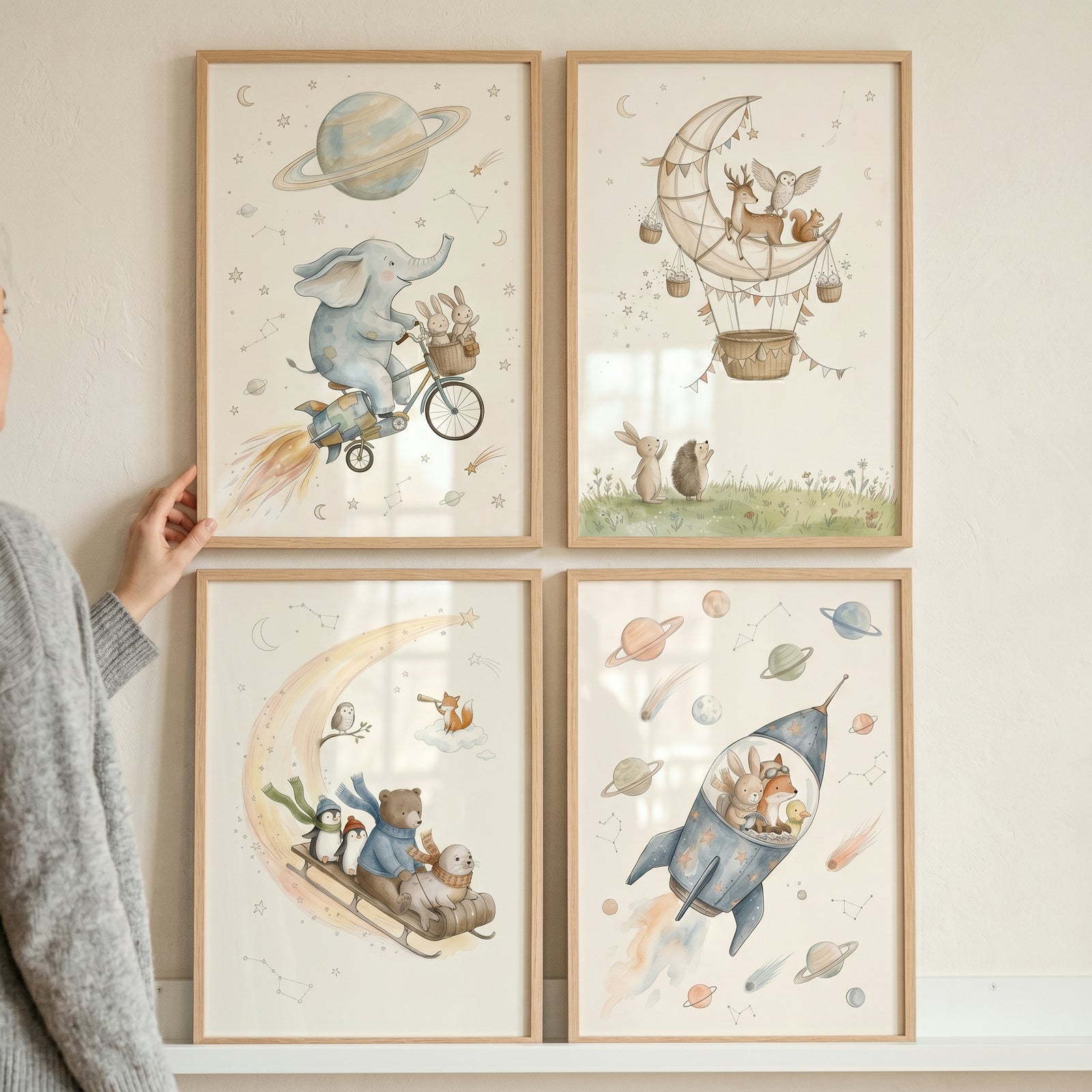 Pastel watercolor space animals wall art set of 4 with animals on a rocket, bike, sled, and moon hot air balloon.
