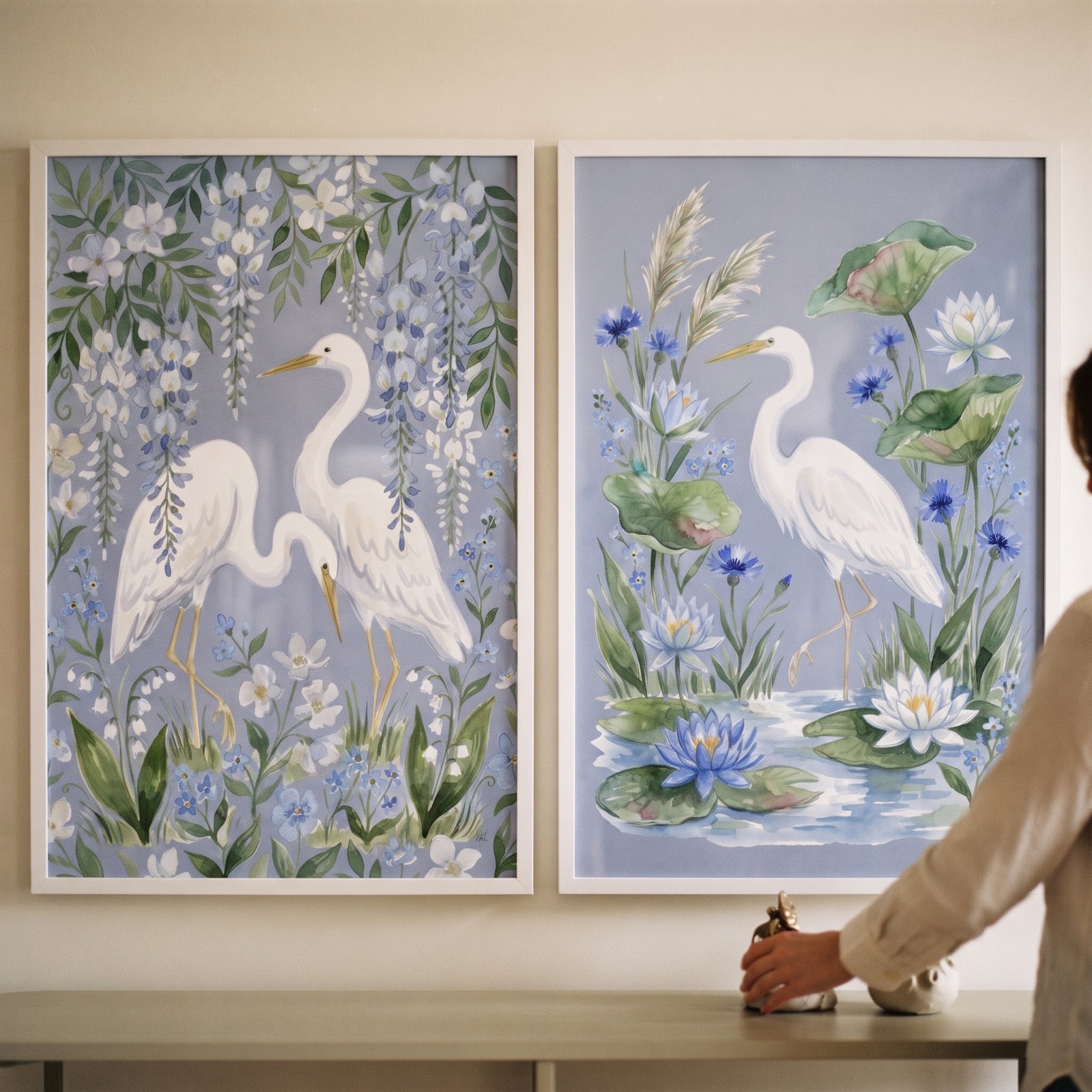 Pastel watercolor white egret bird wall art set of 2 featuring soft blue florals and wisteria in white frames.