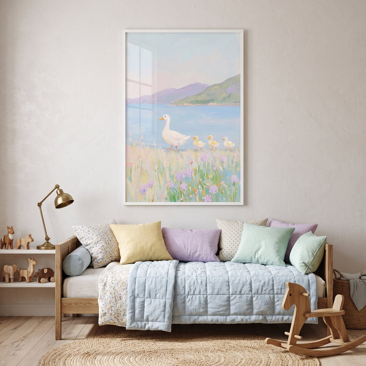 Pastel wildflower meadow duck wall art hangs above a daybed with soft pillows, a blue quilt, and a wooden rocking horse.