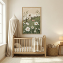 A cozy nursery features a wooden crib with a soft blanket draped over the side, next to a basket filled with plush toys. A large, charming painting of a girl and a piglet in a flower-filled meadow hangs above the crib. Soft natural light filters through a nearby window, illuminating the neutral-toned room.