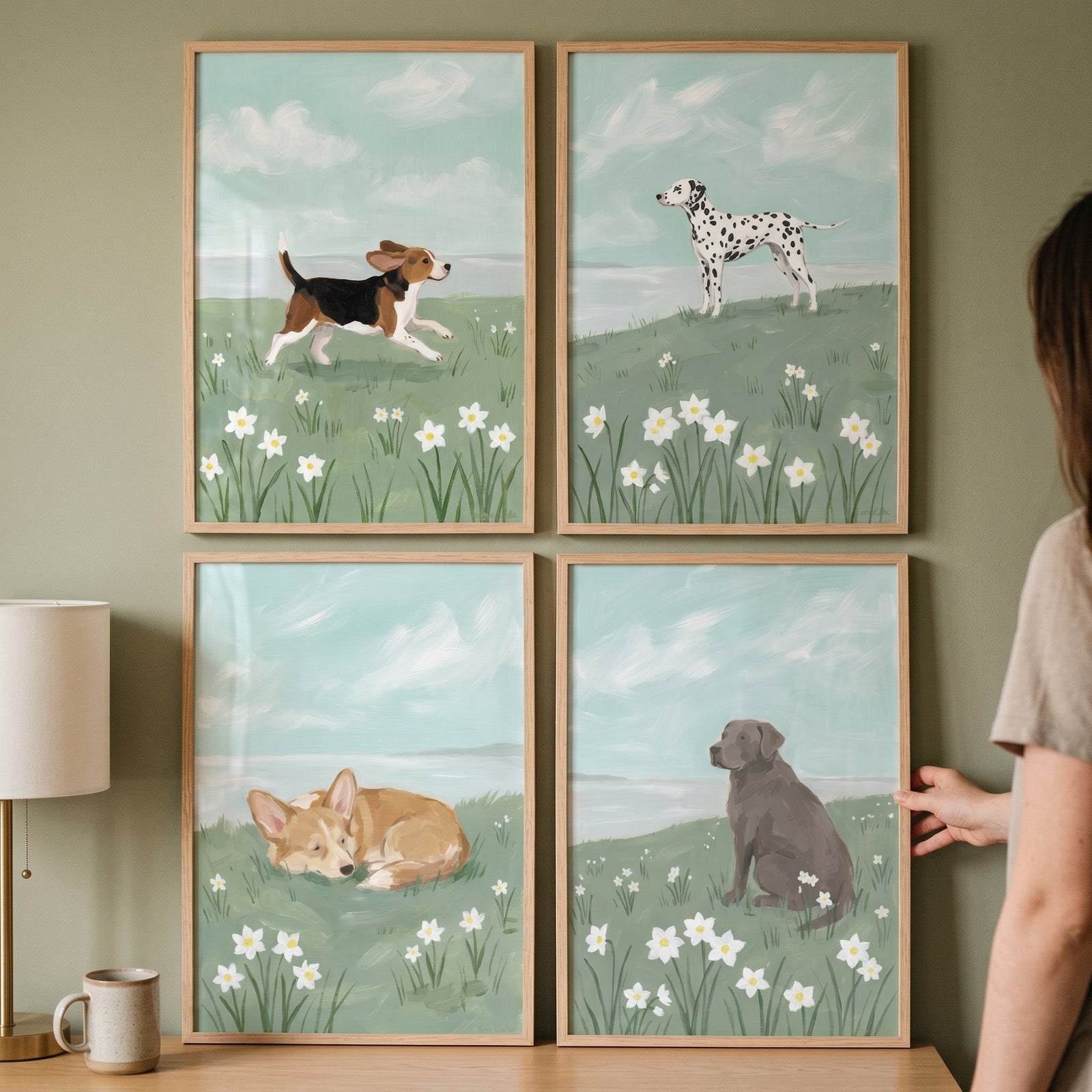 A pastoral spring meadow dog wall art set of 4 displays different breeds in flower fields on a green wall.