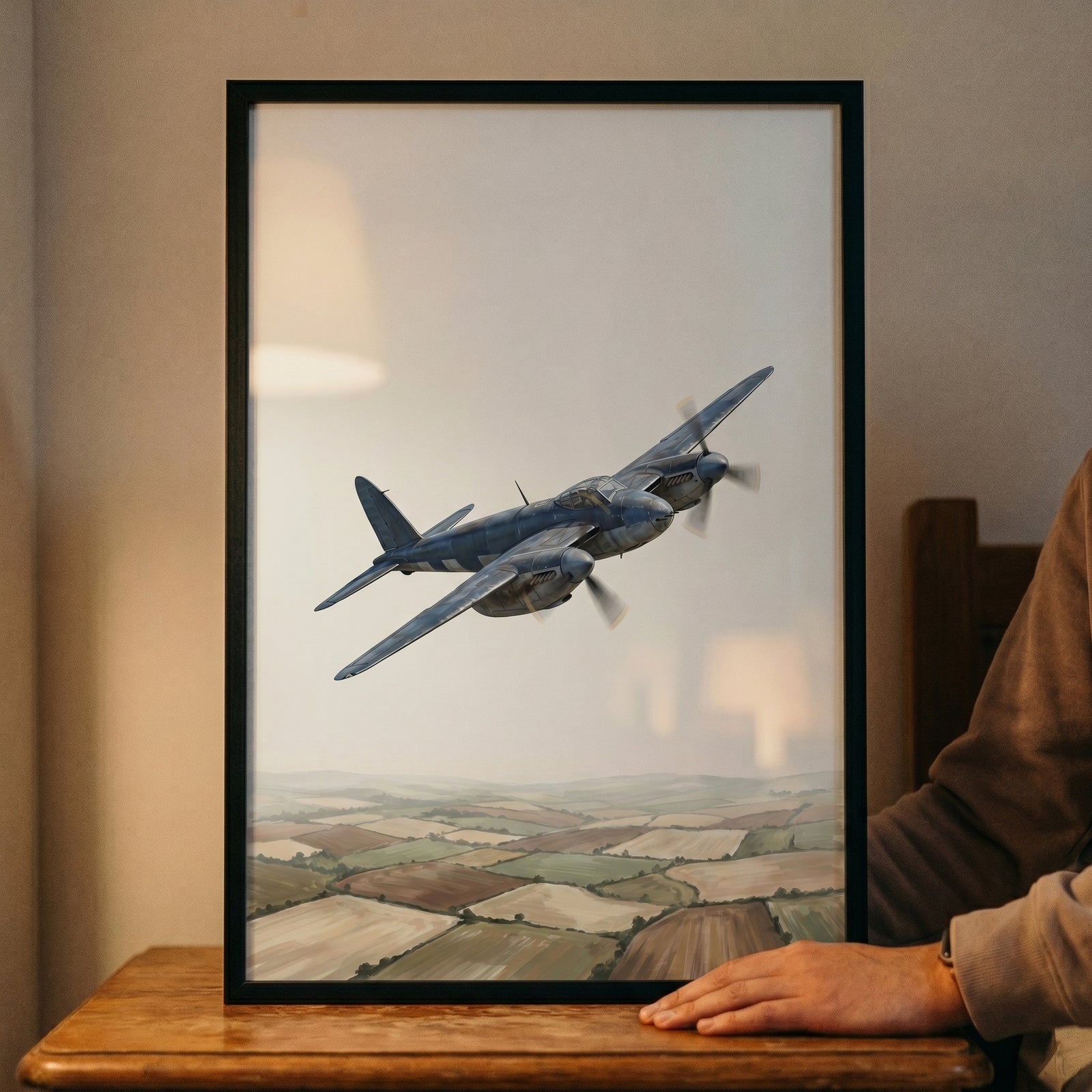A twin-engine aircraft flies over rural countryside in this patchwork field vintage airplane wall art.