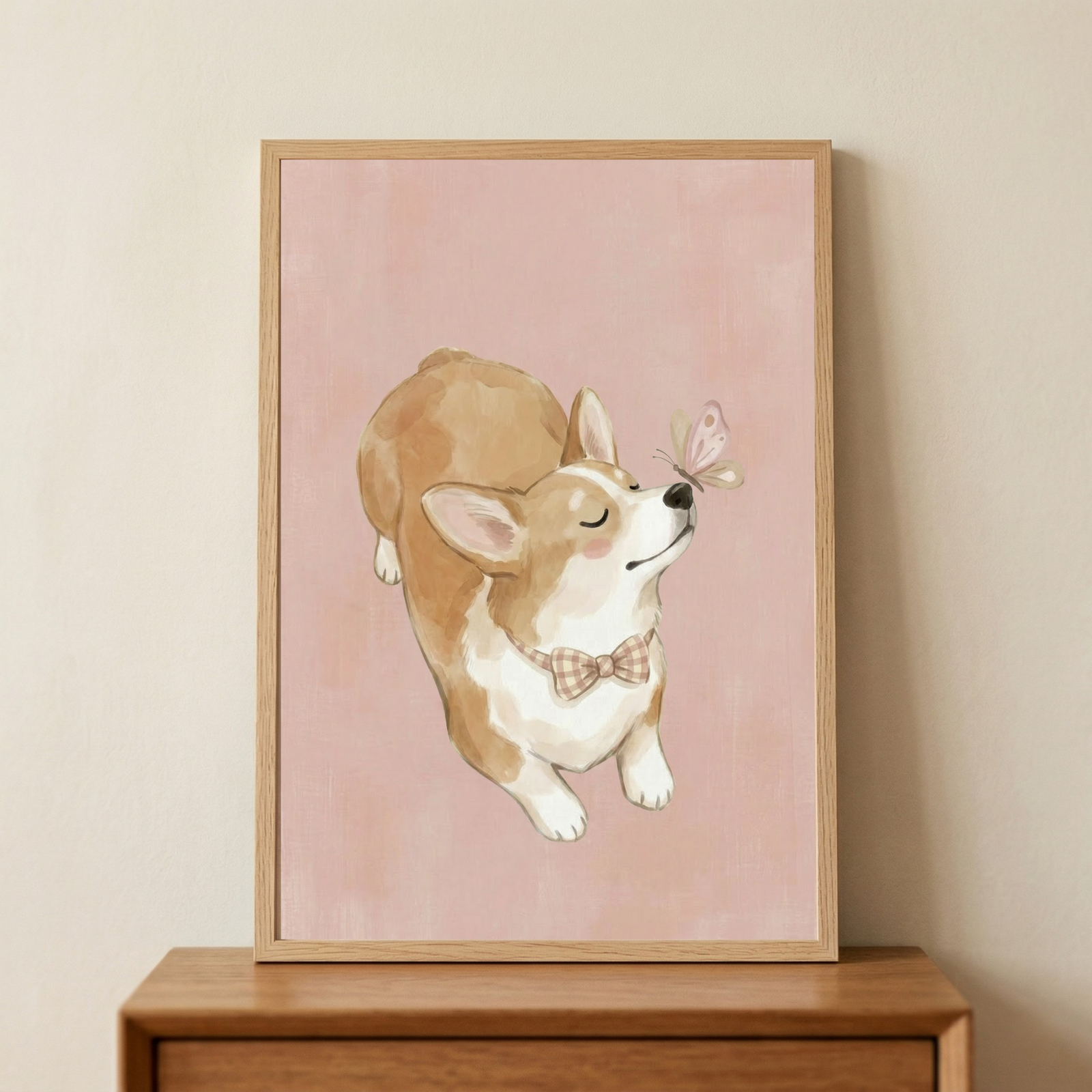 A framed illustration of a small, light brown and white short-legged dog lying down and looking upward with its eyes closed in a calm expression. It wears a brown-and-white checkered bow tie. A delicate pink butterfly hovers just above its nose. The scene is set against a soft, textured pastel pink background. 