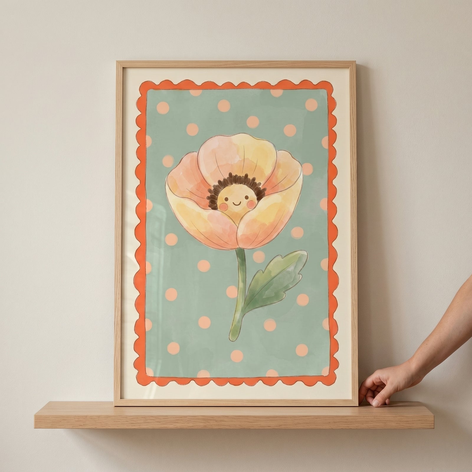 Peach polka dot flower wall art featuring a smiling blossom, green dotted background, and scalloped orange border in a frame.