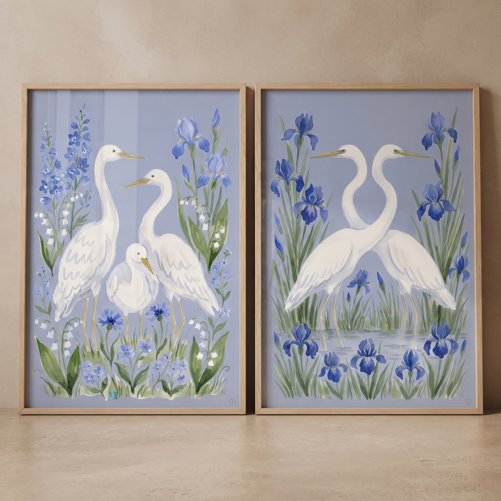 Periwinkle garden white egret bird wall art set of 2 with white egrets and blue irises in light wood frames.