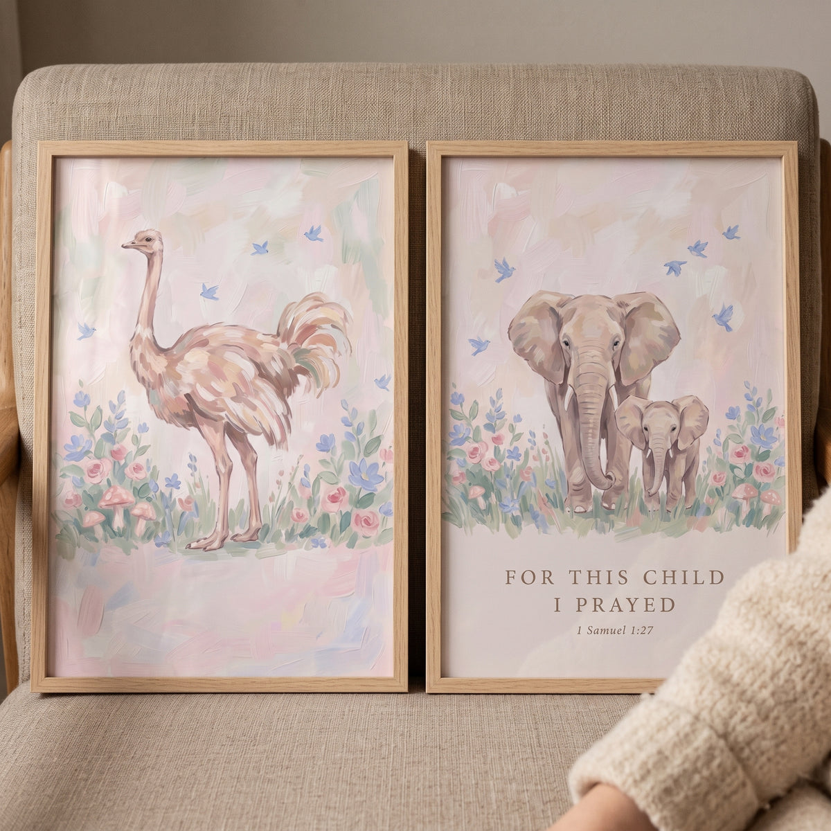 Pink botanical safari animals wall art set of 2 features an ostrich and elephants in floral landscapes with a Bible verse.
