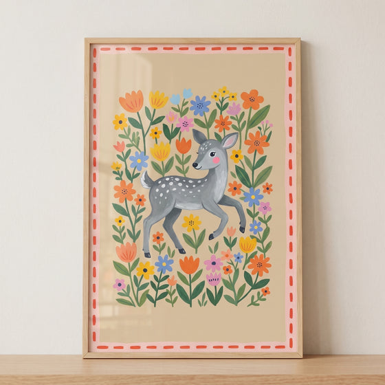 Pink cheeked baby deer wall art features a gray spotted fawn surrounded by vibrant orange, yellow, and blue flowers.