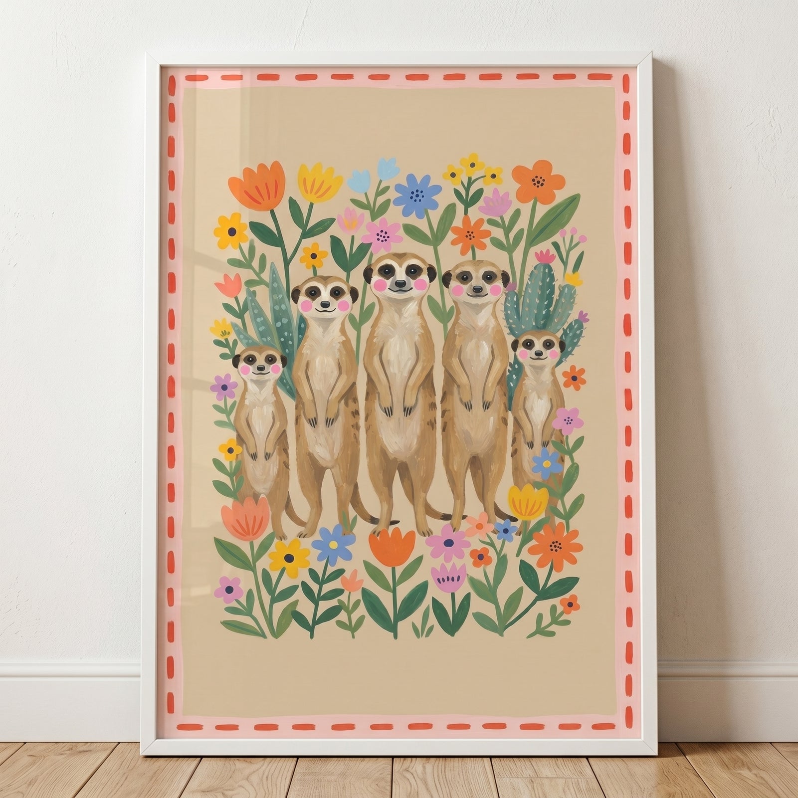 Framed pink cheeked standing meerkat wall art shows five meerkats among colorful flowers and a pink decorative border.
