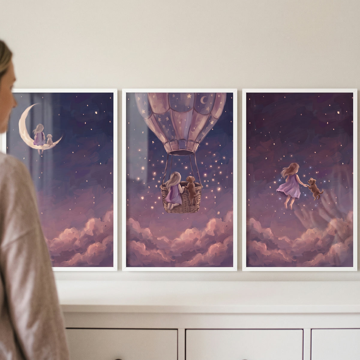 Pink clouds girl dog wall art set of 3 showing a girl and dog on a moon, in a hot air balloon, and among the stars.
