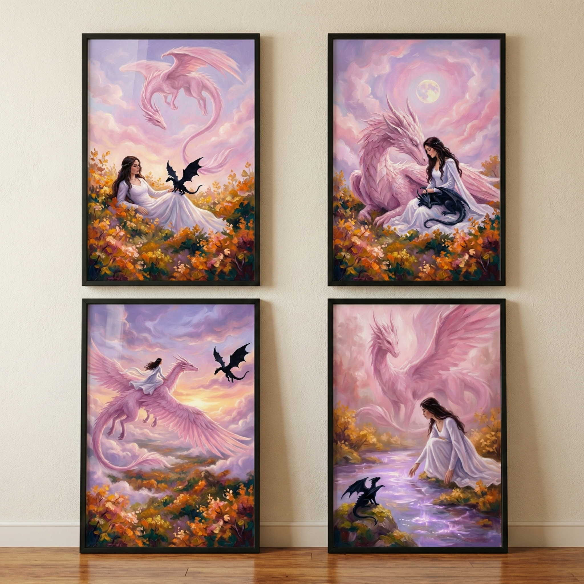 Four framed vertical illustrations are arranged in a two-by-two grid on a light-colored wall. Each artwork features a woman in a white gown in a fantasy setting with a large, pastel-pink winged dragon and a small black dragon. The scenes include the woman resting in a field of orange flowers, sitting beside the large dragon under a full moon, soaring through a sunset sky on the pink dragon's back, and kneeling by a glowing purple stream while a translucent dragon figure looms behind.