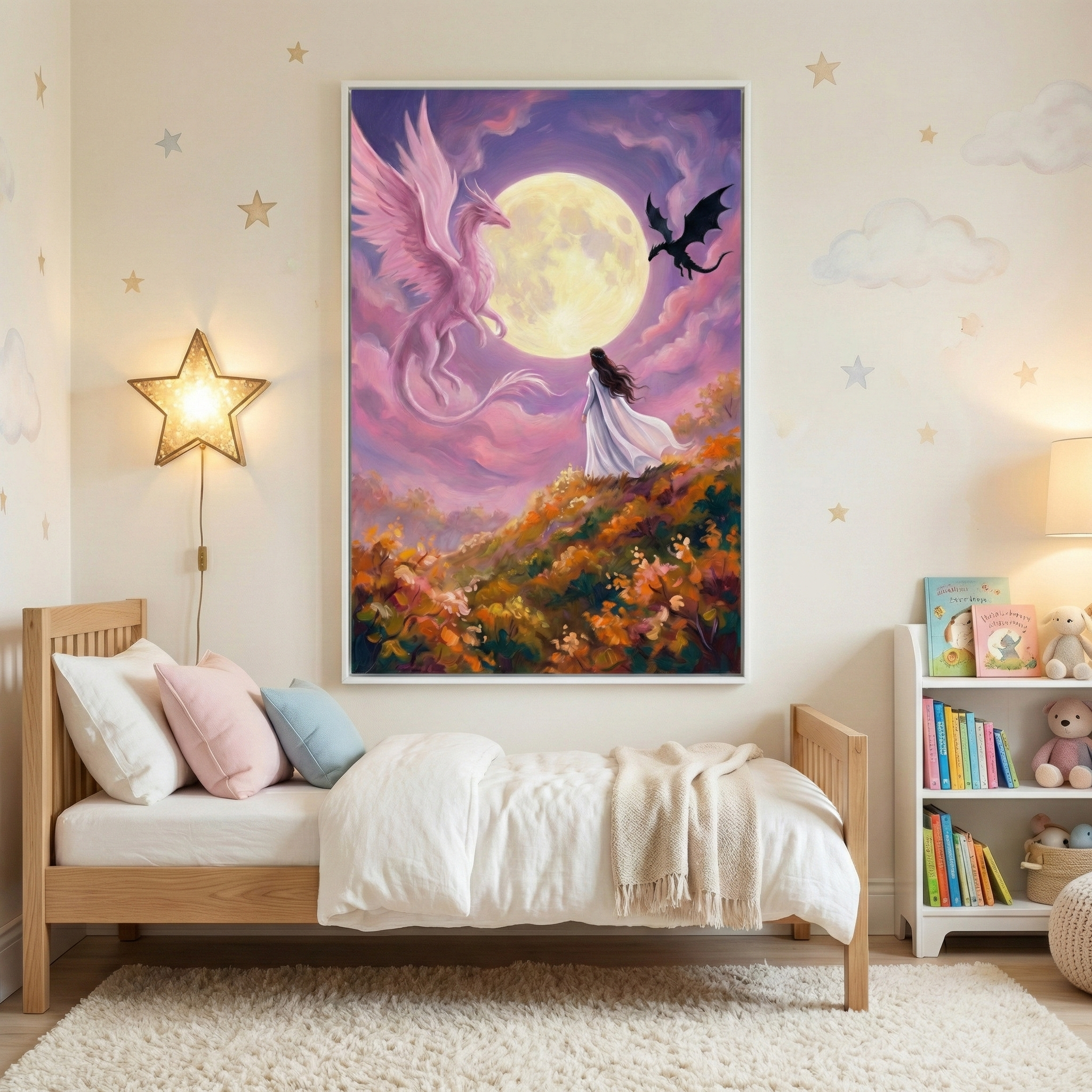 A cozy children's bedroom features a wooden bed with white and pastel pillows, a star-shaped wall lamp, and a large, colorful painting. The artwork depicts a woman in a flowing dress standing on a flower-covered hill, gazing at a large moon, with a pink dragon and a black dragon flying nearby. The room is softly lit, with star and cloud decals on the walls and a small bookshelf filled with books and toys.