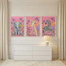 A bright room features three framed illustrations of whimsical safari animals above a white six-drawer dresser. The prints have a pink background with colorful flowers. From left to right, they show a seated grey elephant holding a flower, a cute giraffe, and an adult zebra with its baby. A simple white lamp sits on the dresser. The space is finished with light-colored curtains, a plush rug, and classic wall molding.