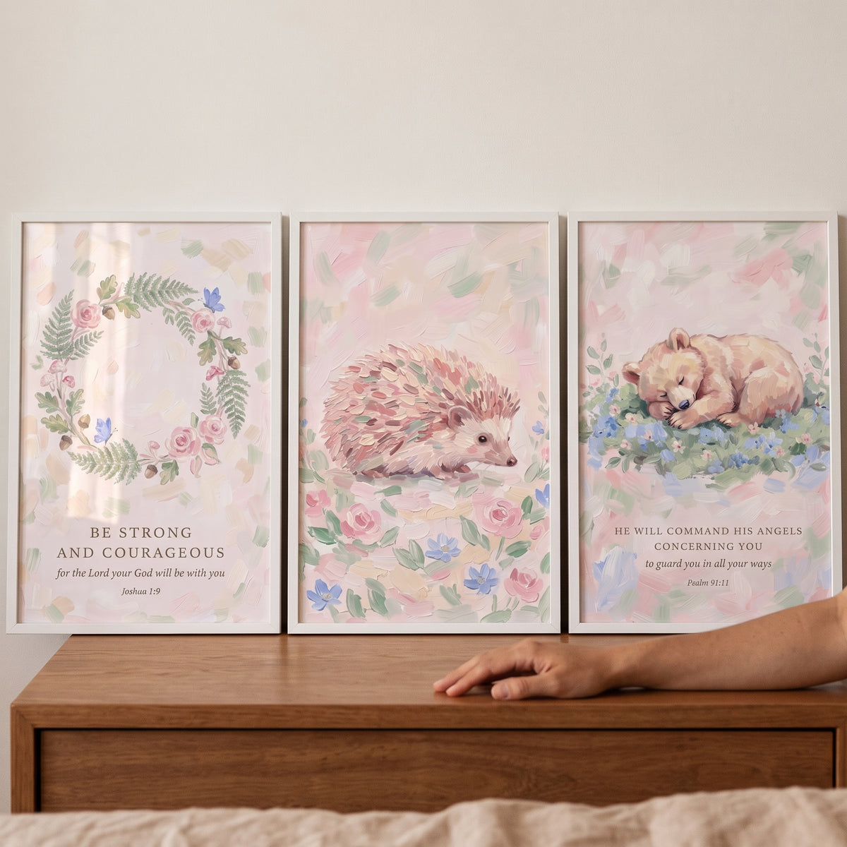 Pink floral bible verse floral wall art set of 3 with a wreath, a hedgehog, and a sleeping bear cub.