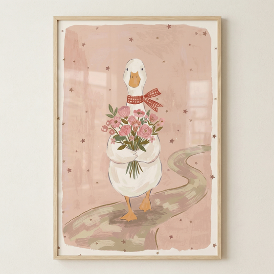 A vertical illustration features a charming white goose as the central subject. The goose is depicted walking forward along a winding, light brown path. Around its neck, the goose wears a red and white checkered bow. It holds a large bouquet of various pink flowers with green leaves and stems tucked against its chest. The background consists of a soft, muted pink color with small, scattered brown star motifs. 