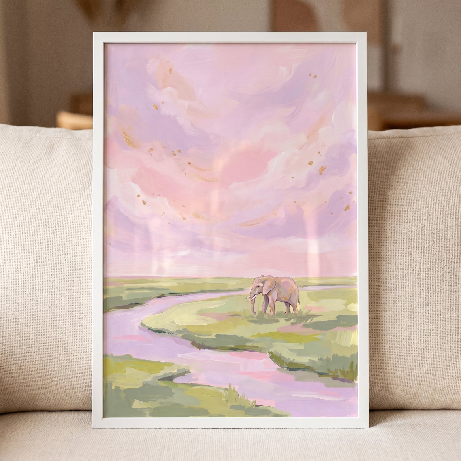 An elephant walks through a field near a river in this pink lavender sky elephant animal wall art.