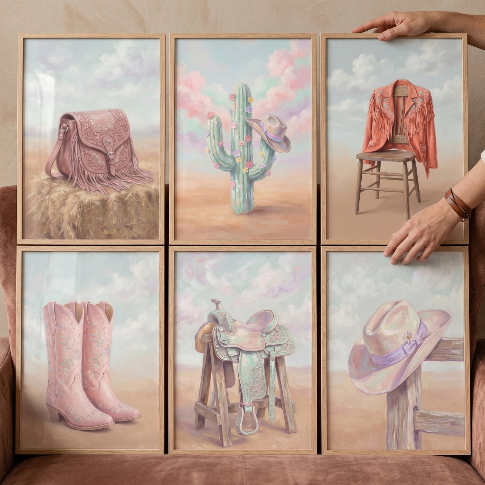 Pink pastel cowgirl wall art set of 6 featuring a saddle, boots, hats, and a fringe jacket in soft desert colors.