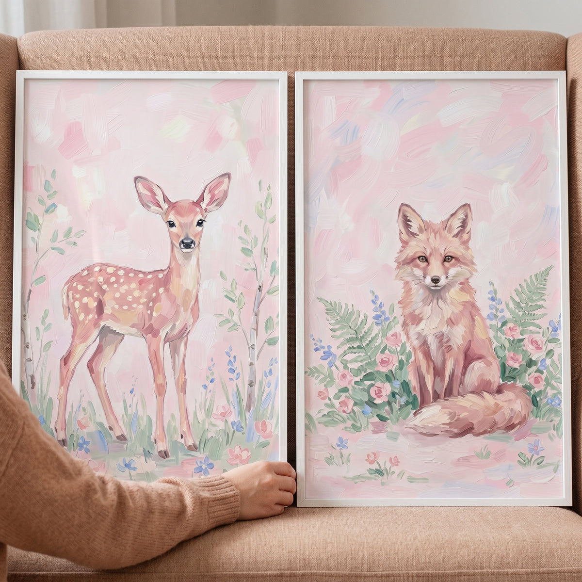 Pink pastel woodland animals wall art set of 2 with a fawn and a fox in white frames against soft floral backgrounds.