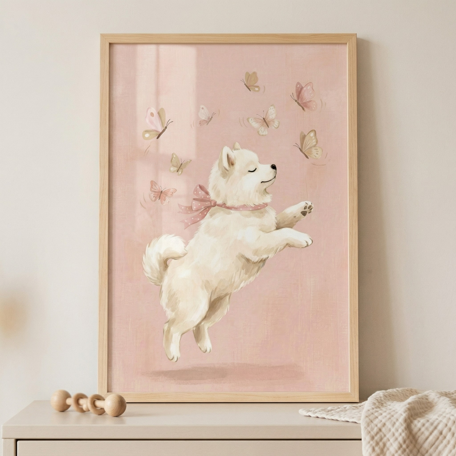 A soft-toned illustration of a fluffy white puppy is showcased within a light wood frame. The puppy is captured in a graceful leap, its eyes closed with a peaceful expression and its paws tucked as if jumping through the air. A delicate pink ribbon is tied around its neck. 