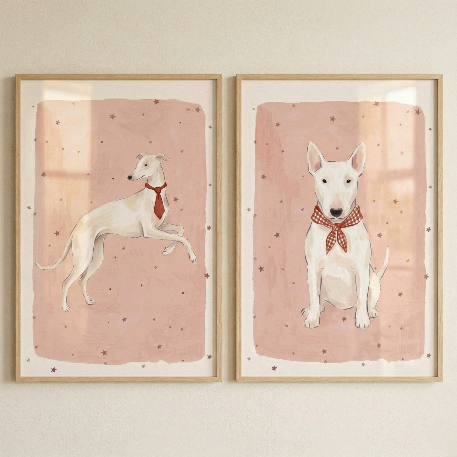 This pair of framed illustrations showcases two white dogs in a soft, whimsical style. The left frame features a slender, long-legged dog in profile wearing a red necktie. The right frame shows a sturdy dog with upright ears sitting forward, wearing a red and white checkered bow tie. 