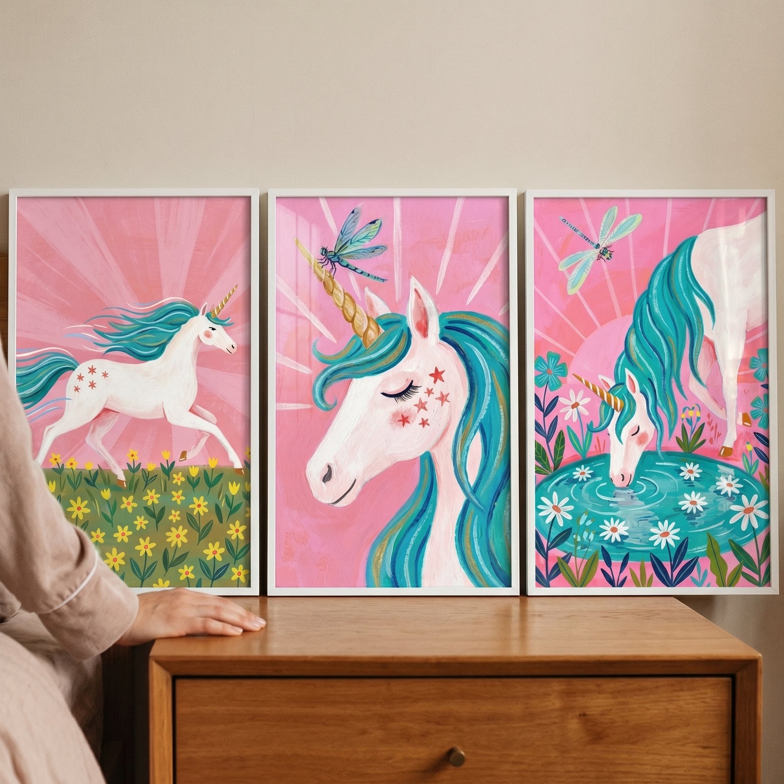 pink teal mane unicorn wall art set of 3 features a unicorn running, a close-up, and one drinking from a floral pond.