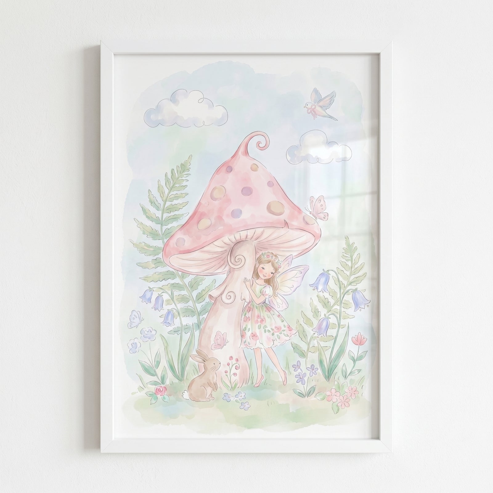 Pink toadstool fairy wall art with a winged girl, bunny, and blue flowers beside a large spotted mushroom in a frame.