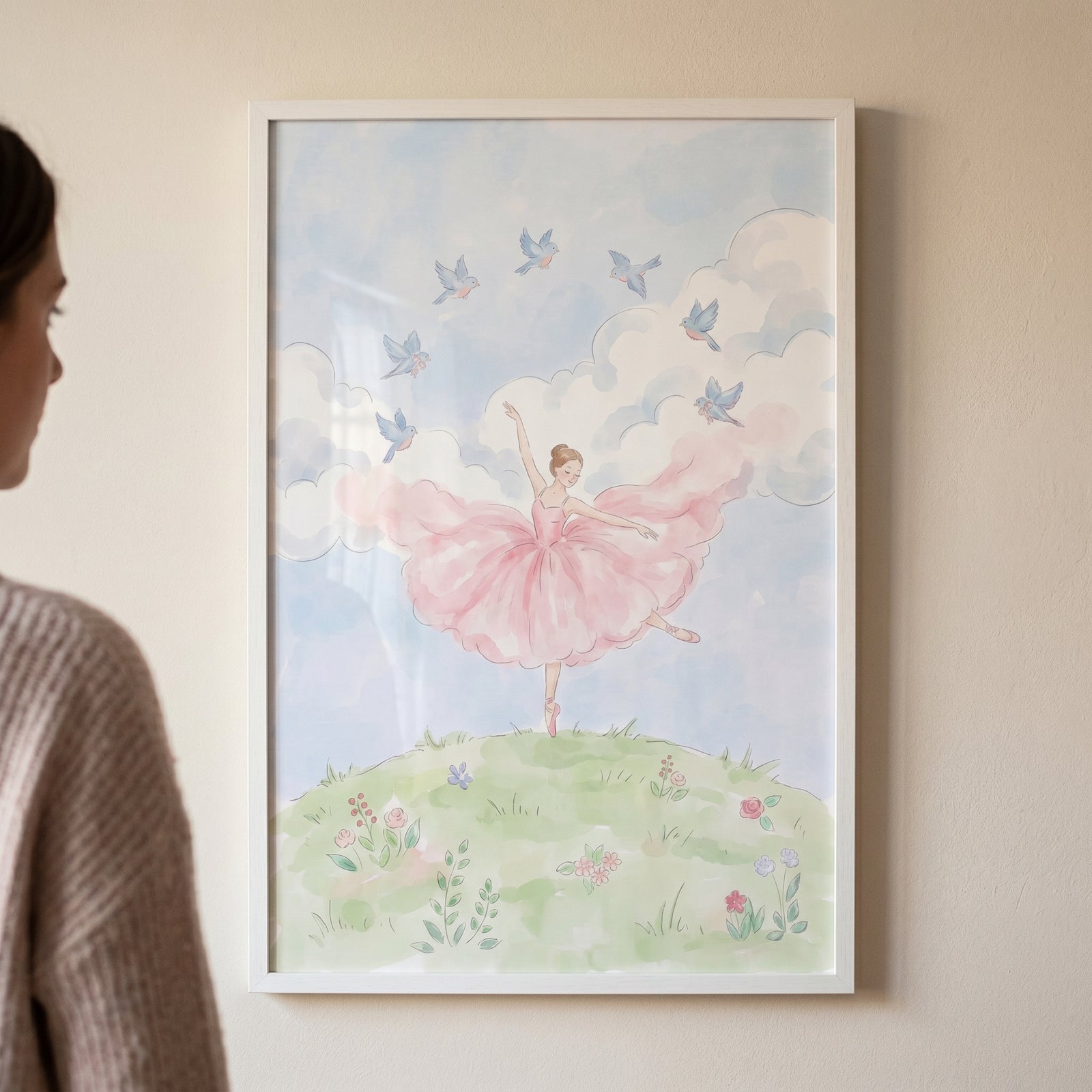 Framed pink tutu dancing ballerina wall art of a dancer on a flowery hill with blue birds and a soft cloudy sky.