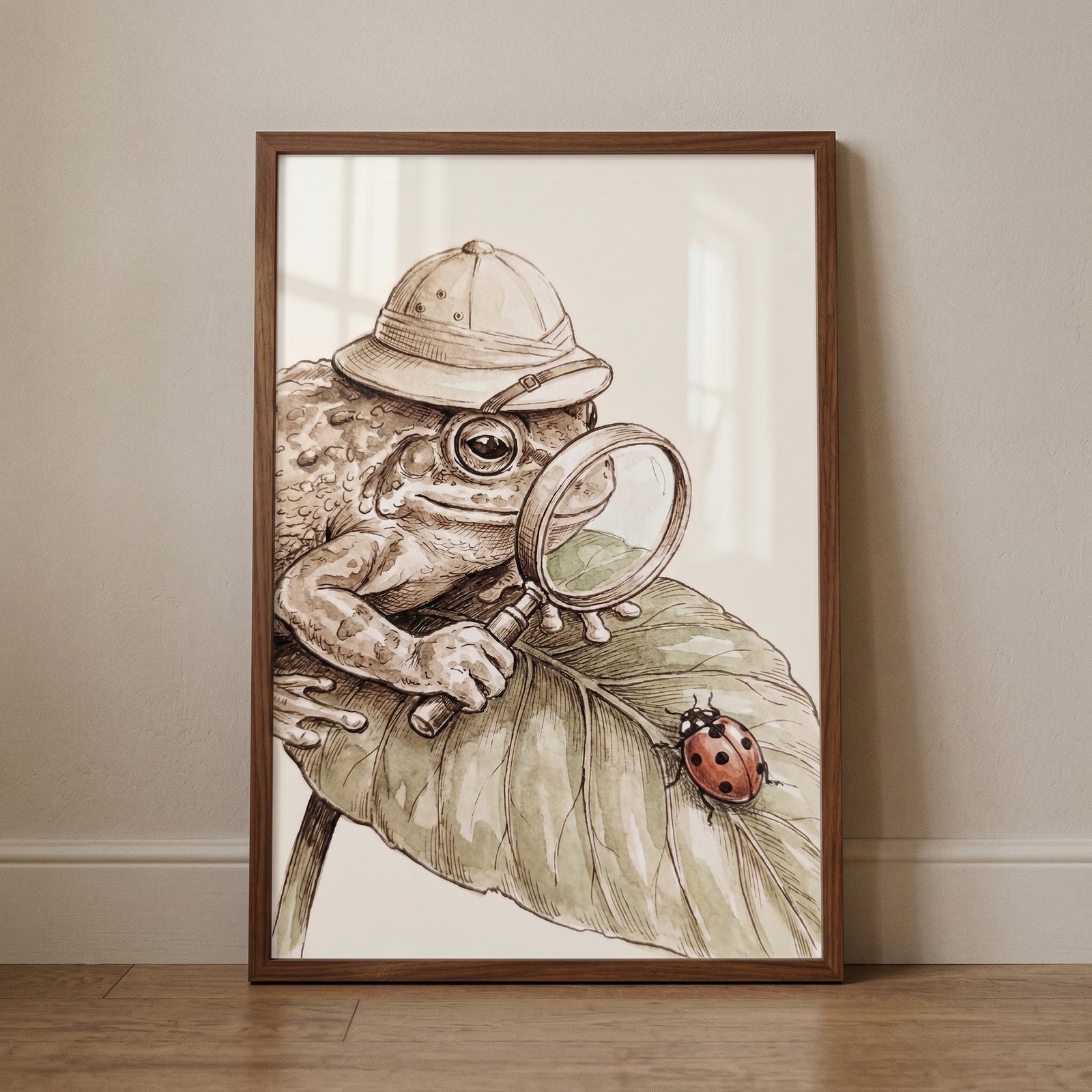 Pith helmet explorer toad wall art features a toad using a magnifying glass to look at a ladybug on a leaf.