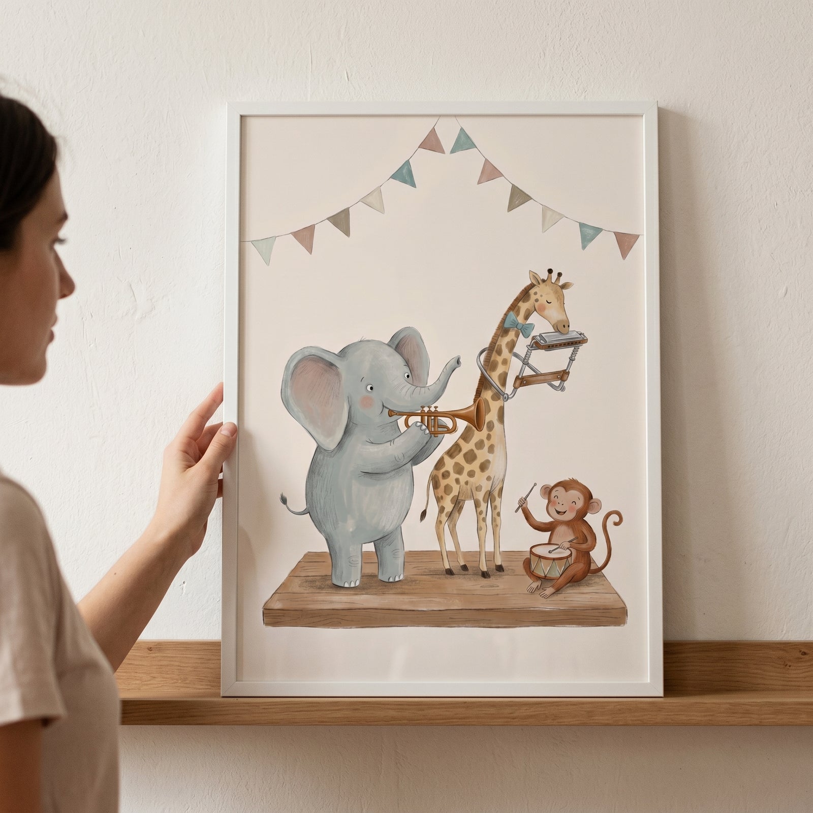 Playing band animals wall art with an elephant, giraffe, and monkey playing instruments, held up by a woman.