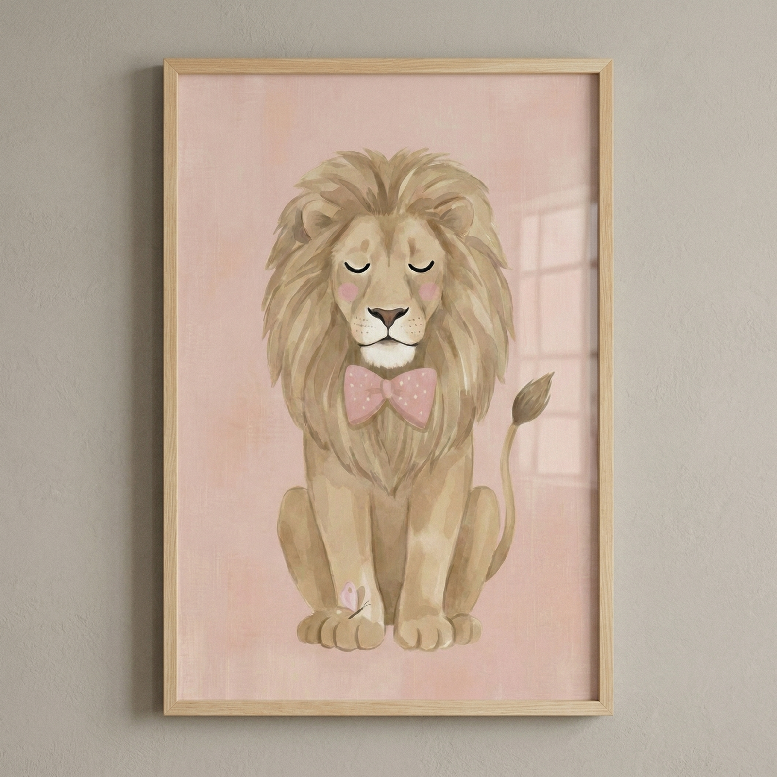 This vertical framed illustration features a gentle, cartoon lion centered against a soft pink, textured background. The lion is shown sitting down with its eyes closed, sporting a serene expression and rosy pink cheeks. It has a thick, layered mane in shades of light brown and tan. 

