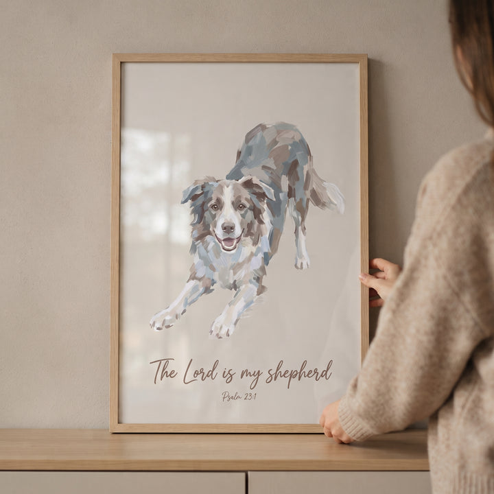 Framed psalm 23 border collie wall art featuring a dog in a play bow with religious text, held up by a person.