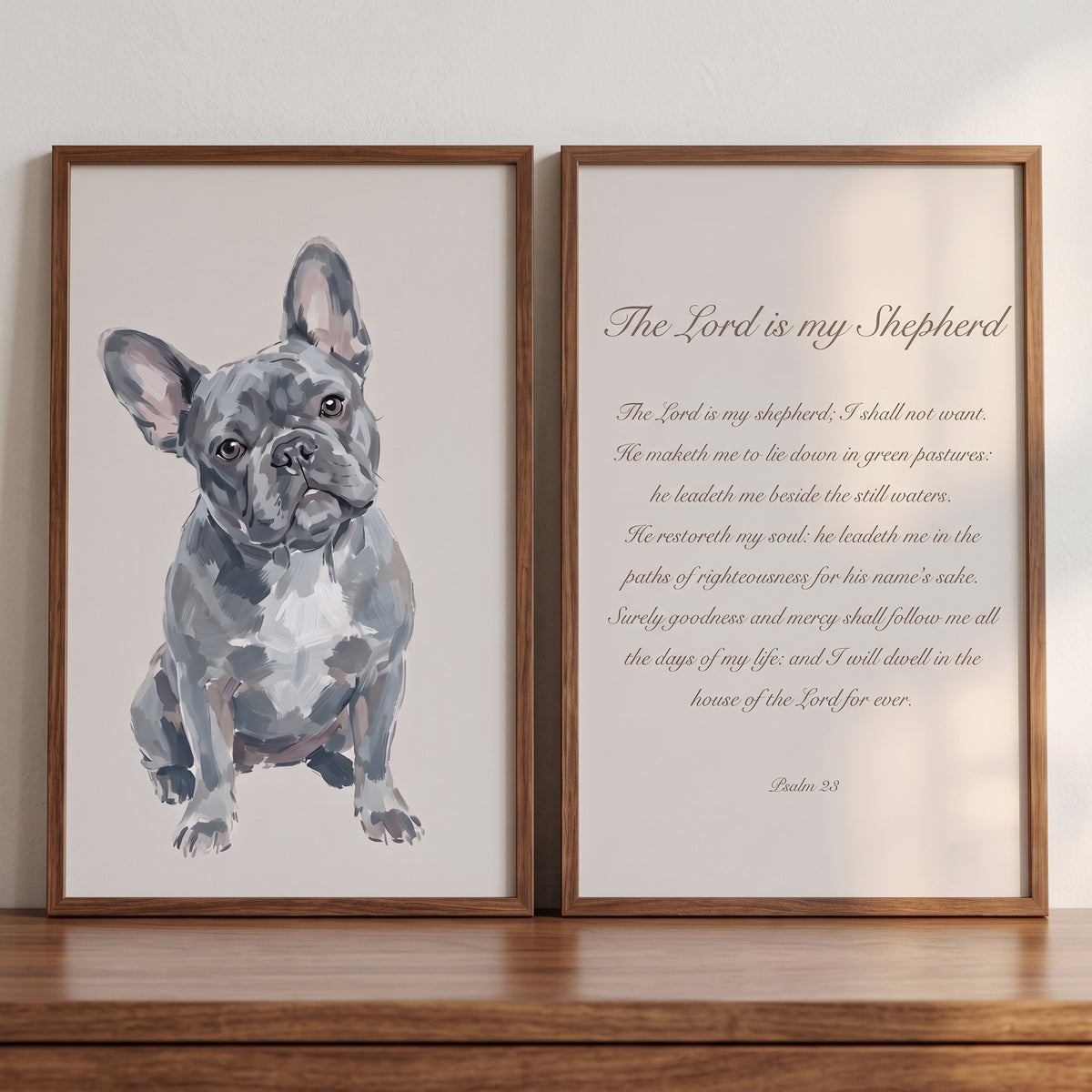 A psalm 23 french bulldog wall art set of 2 with a grey dog illustration and scripture text displayed in wooden frames.