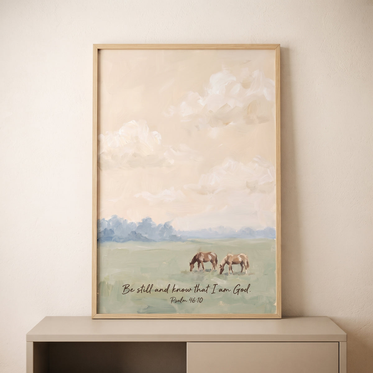 Psalm 46 10 horse wall art featuring two grazing horses in a soft, muted landscape under a cloudy sky.