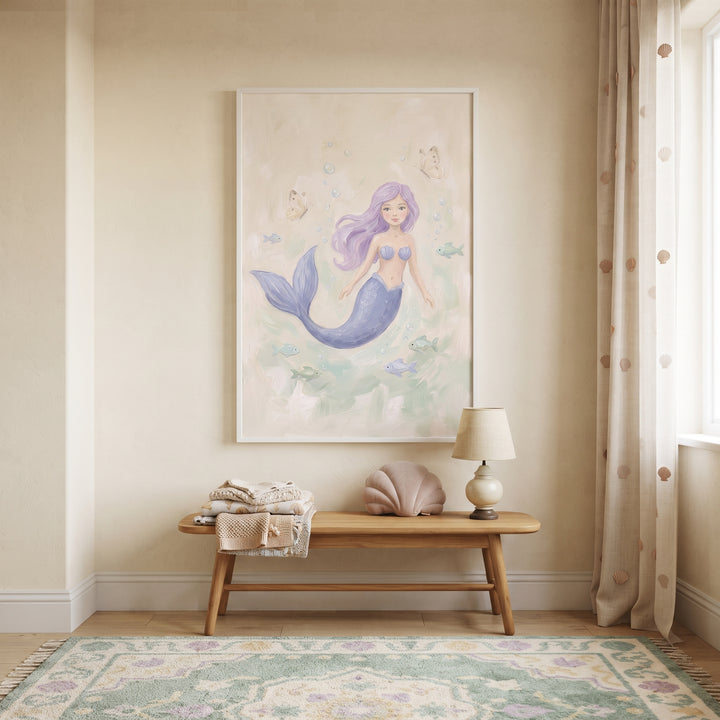 Purple hair mermaid wall art hangs above a wood bench with a shell pillow, lamp, and blankets in a beige room with curtains.