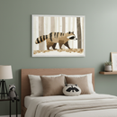 Modern kid's bedroom with a sage green wall and wooden bed, featuring a raccoon-face pillow. A framed print of a stylized brown raccoon in a forest hangs centered above the bed. A nightstand with a lamp and raccoon plushie is to the left.