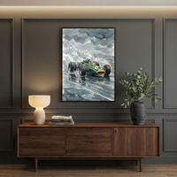 A stylish room features a framed painting of a vintage green race car with the number 18, speeding through rain-soaked streets under cloudy skies. The painting is displayed above a wooden sideboard, which holds a modern lamp, books, and a vase with leafy branches.
