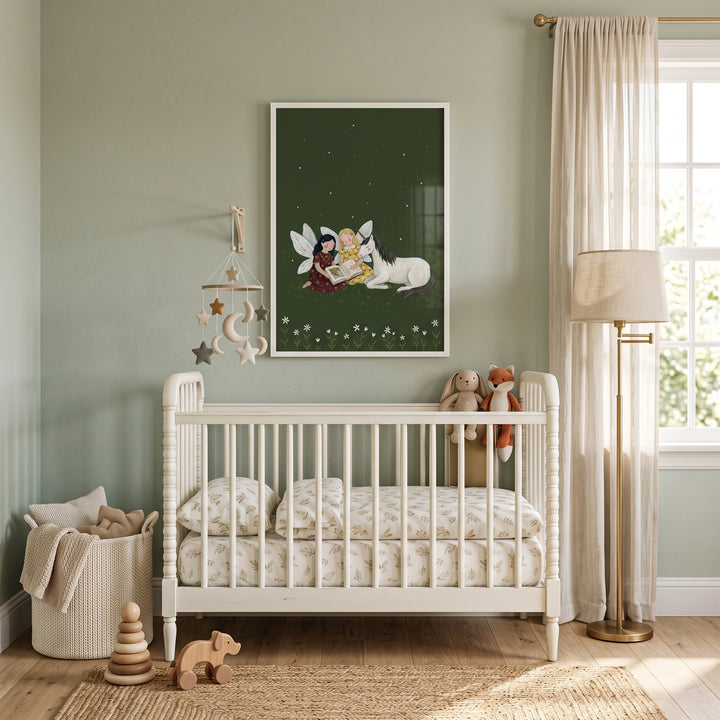 A sage green nursery features a white wooden crib, floor lamp, and reading storybook unicorn fairies wall art.