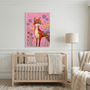 A framed illustration of a red fox standing among colorful wildflowers on a vibrant pink background hangs on a white wall with decorative molding. The artwork is centered above a light-colored wooden crib dressed in neutral bedding. A soft, cream-colored knit blanket is draped over the crib's railing. To the right stands a tall floor lamp with a simple drum shade, next to a plush armchair and a chunky knit throw. The floor is covered with a patterned rug in soft, muted tones.