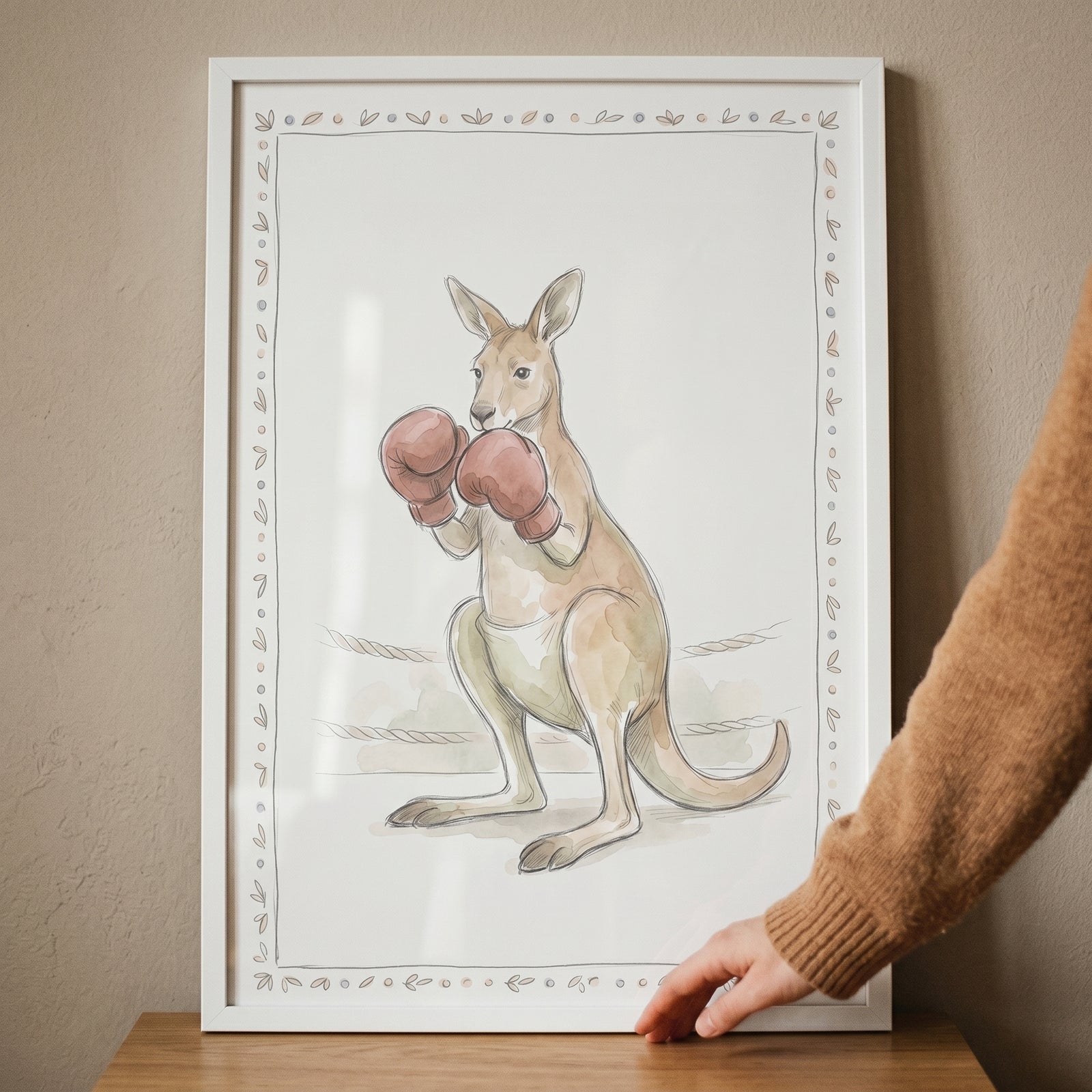 Framed red glove boxing kangaroo wall art in a watercolor style with a simple ring background and decorative border.