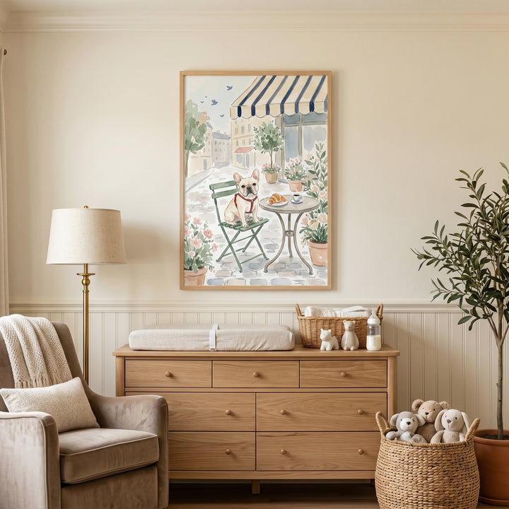 Neutral nursery featuring red harness french bulldog wall art above a wooden dresser and changing station.