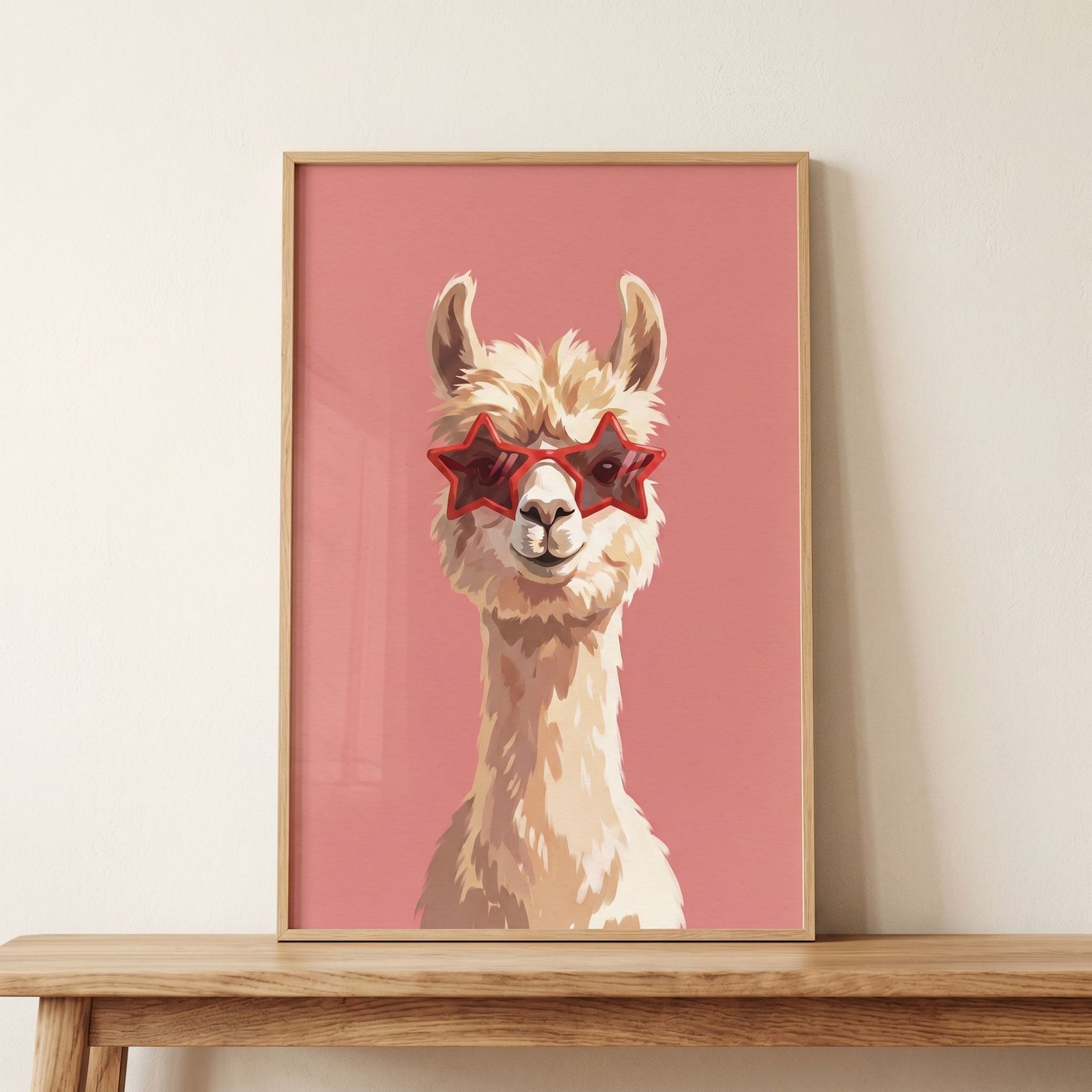 Red star glasses llama wall art featuring a cream llama in star-shaped sunglasses on a pink background in a wood frame.
