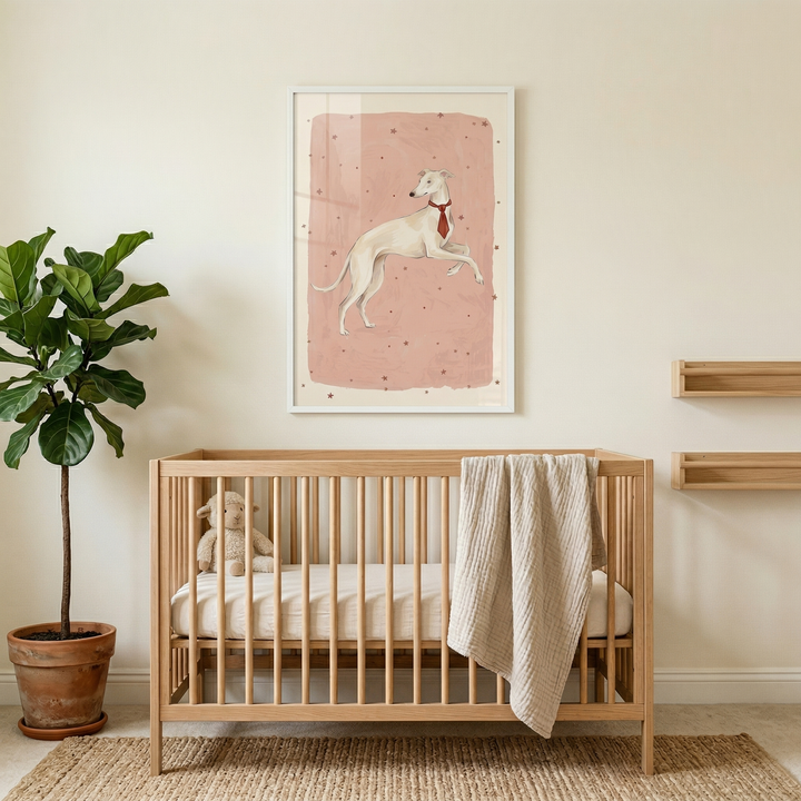 Minimal nursery with a wooden crib styled beneath a framed illustration of a white dog wearing a red tie on a soft pink background with small stars. A leafy potted plant, neutral textiles, and a plush toy create a calm and cozy atmosphere around the crib.