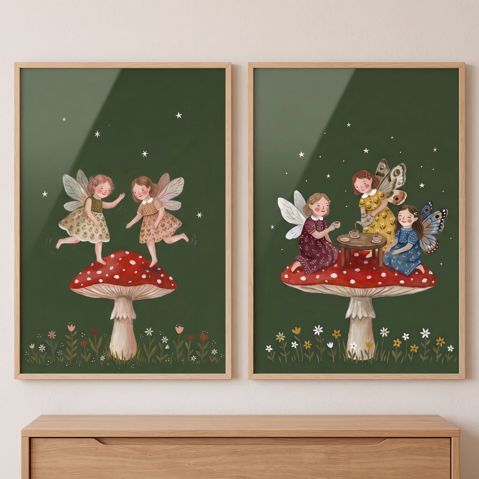 Red toadstool garden fairies wall art set of 2 shows fairies dancing and sharing tea on mushrooms under a starry sky.
