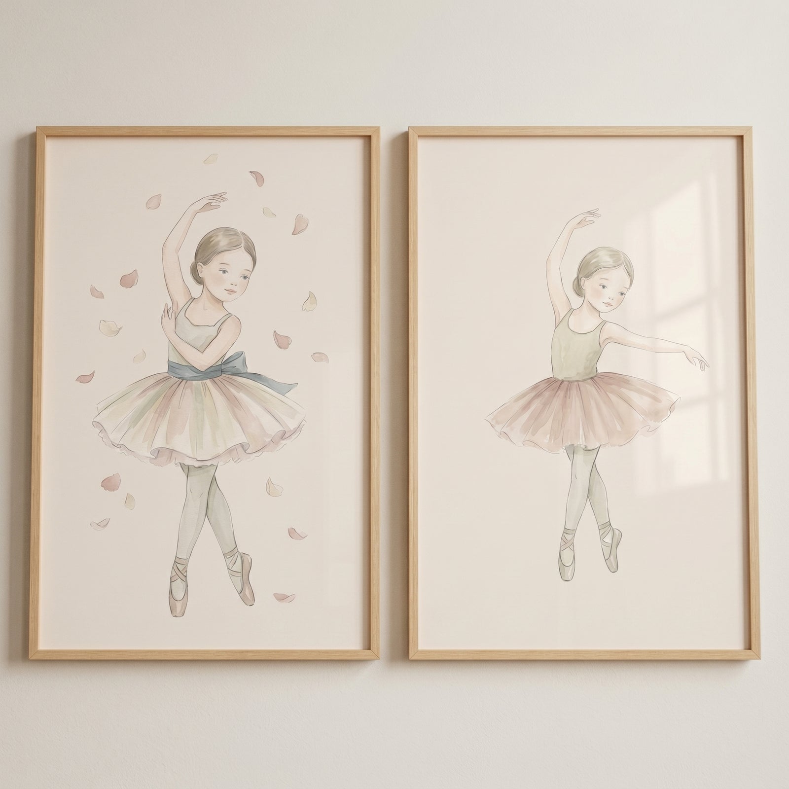 Refined pastel watercolor ballerina wall art set of 2 shows two dancers in soft tutus and petals within wood frames.