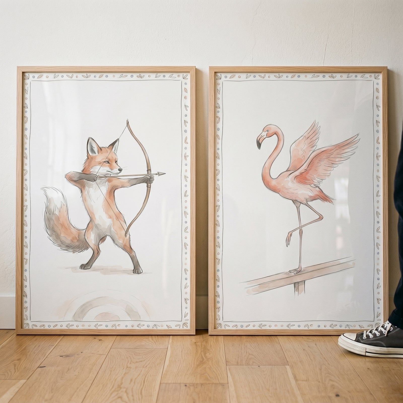 Refined watercolor athletic animals wall art set of 2 featuring an archer fox and a flamingo in light wood frames.