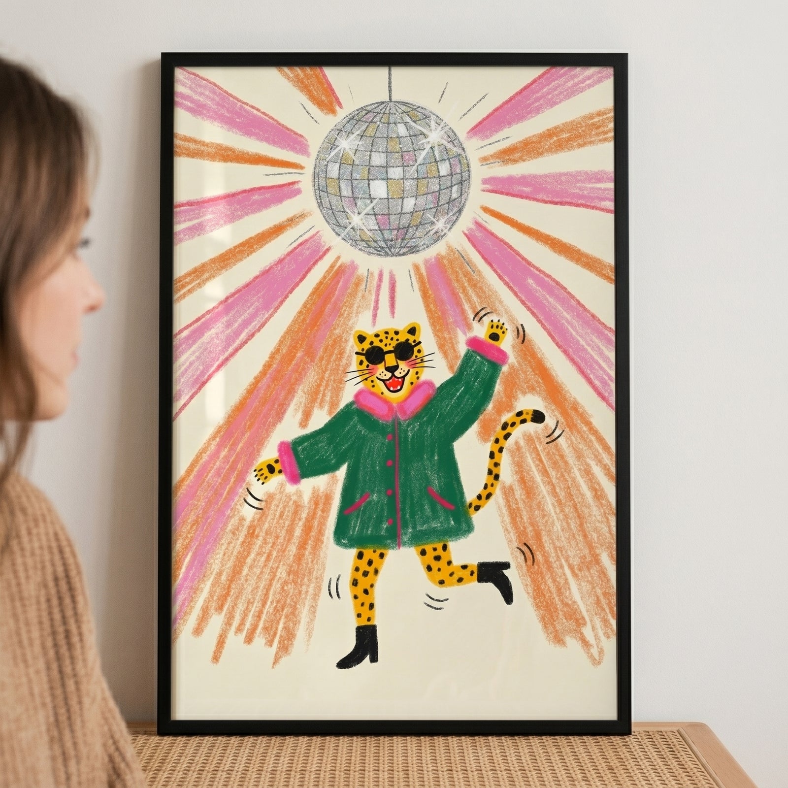 Retro disco ball leopard wall art with a leopard wearing a green coat and sunglasses dancing under pink and orange rays.